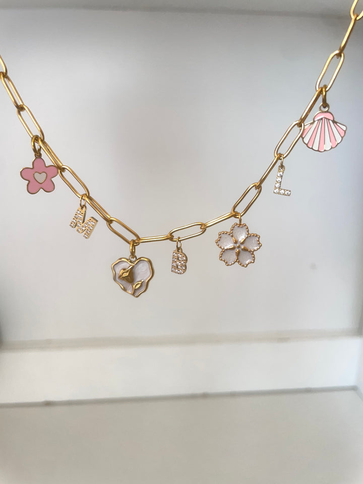 Small baby pink shell charm